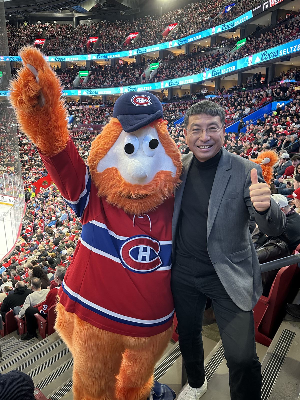Frank Zhou with Youppi! at a Montréal Canadiens game