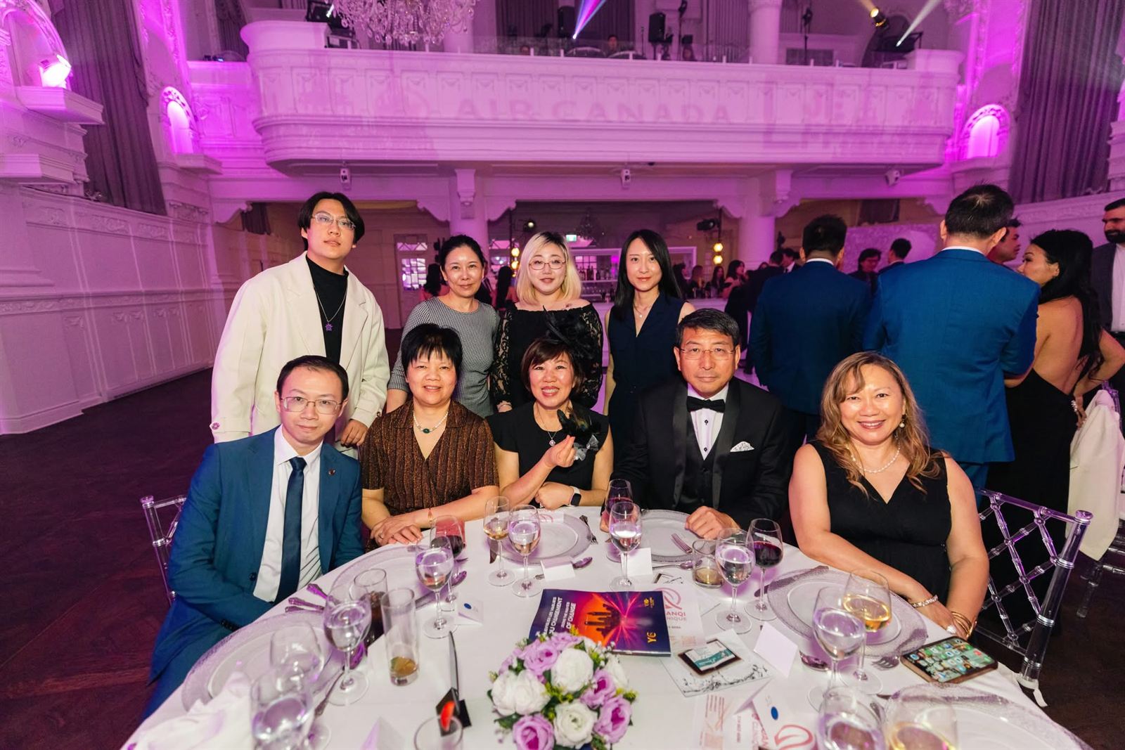 Frank Zhou at a gala table with clients and friends in Montréal
